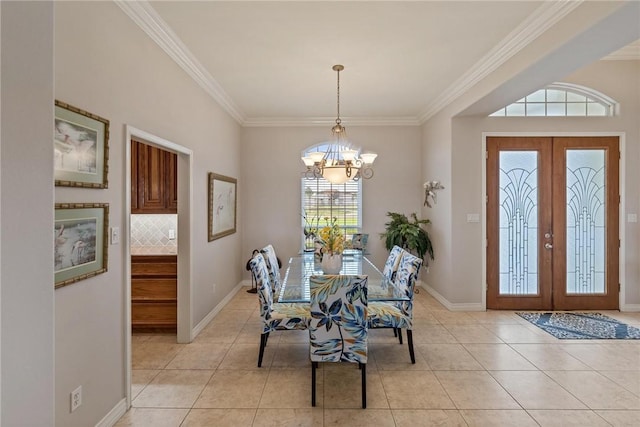 1618 Cantera Bay, Corpus Christi, TX 78418 - dining area featuring light tile patterned floors, ornamental molding, a chandelier, french doors, and baseboards