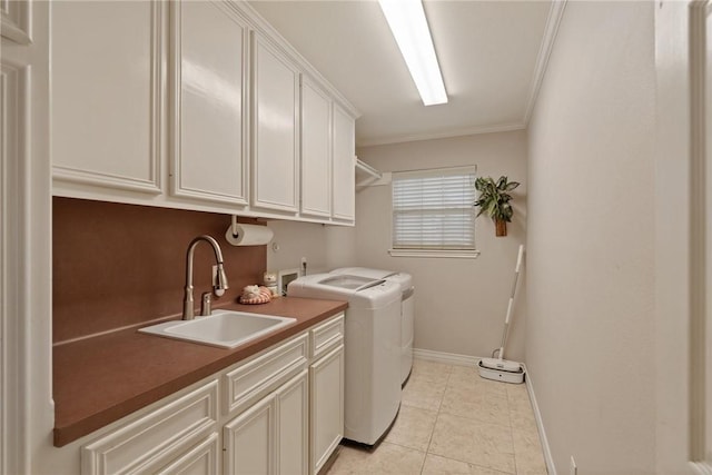 1618 Cantera Bay, Corpus Christi, TX 78418 - laundry room with cabinet space, washer and clothes dryer, baseboards, ornamental molding, and light tile patterned floors