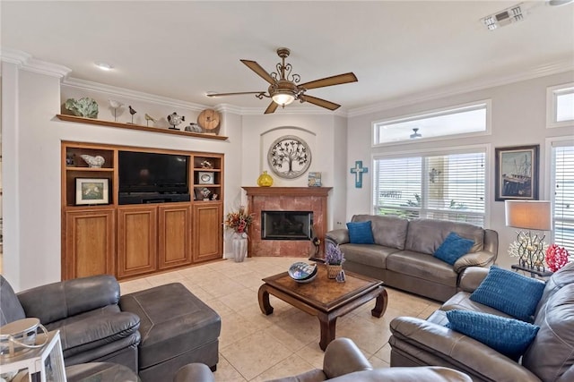 1618 Cantera Bay, Corpus Christi, TX 78418 - living area with crown molding, light tile patterned flooring, ceiling fan, healthy amount of natural light, and a premium fireplace