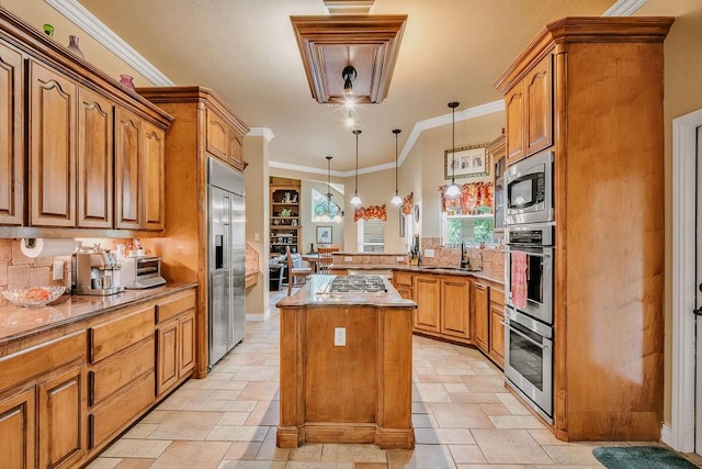 5325 Wild Olive, Corpus Christi, TX 78413 - kitchen with built in appliances, a sink, a peninsula, a kitchen island, and tasteful backsplash