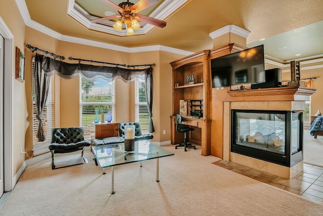 5325 Wild Olive, Corpus Christi, TX 78413 - living room with crown molding, a ceiling fan, a desk, carpet, and a multi sided fireplace