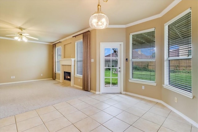 6709 Pembrock, Corpus Christi, TX 78414 - unfurnished living room featuring crown molding, a fireplace with flush hearth, ceiling fan, light colored carpet, and baseboards