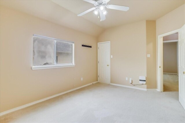 6709 Pembrock, Corpus Christi, TX 78414 - unfurnished bedroom featuring carpet, baseboards, vaulted ceiling, and ceiling fan