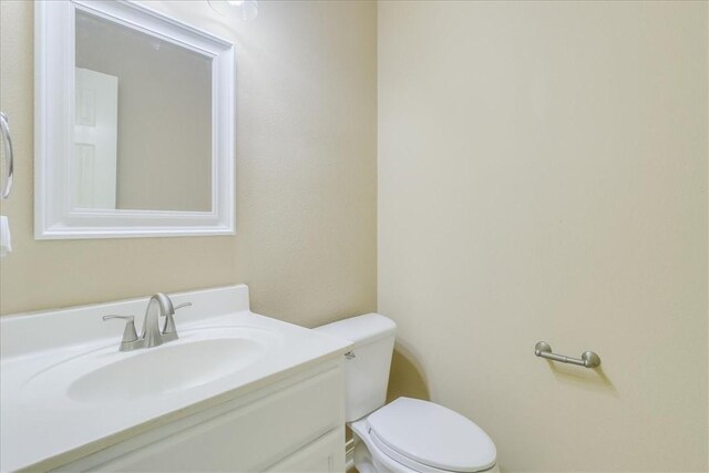 6709 Pembrock, Corpus Christi, TX 78414 - bathroom featuring toilet and vanity