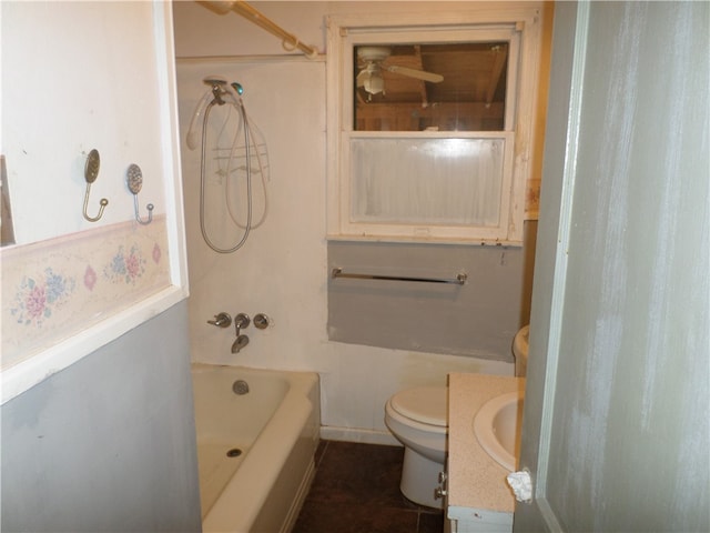 bathroom with toilet, vanity, and tile patterned flooring