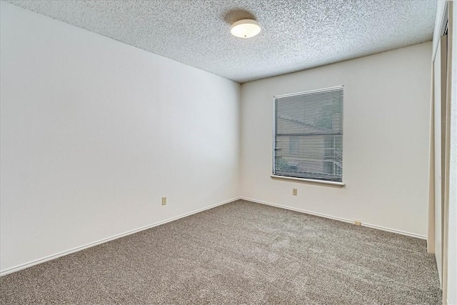 6702 Everhart Unit N102, Corpus Christi, TX 78413 - carpeted spare room with a textured ceiling and baseboards