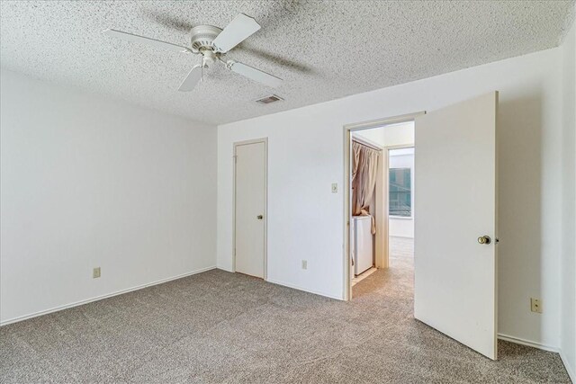 6702 Everhart Unit N102, Corpus Christi, TX 78413 - unfurnished bedroom with carpet, ceiling fan, and a textured ceiling