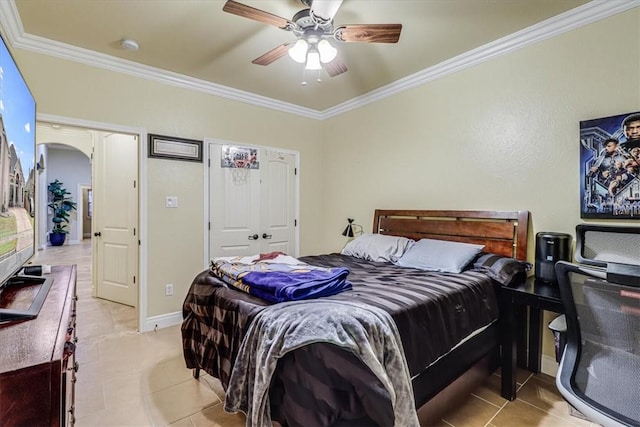 4530 Ballad Tree Dr, Corpus Christi, TX 78410 - bedroom with ornamental molding, light tile patterned floors, arched walkways, a ceiling fan, and baseboards