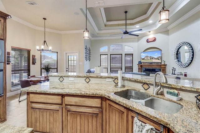 4530 Ballad Tree Dr, Corpus Christi, TX 78410 - kitchen featuring a sink, open floor plan, ceiling fan, a chandelier, and ornamental molding