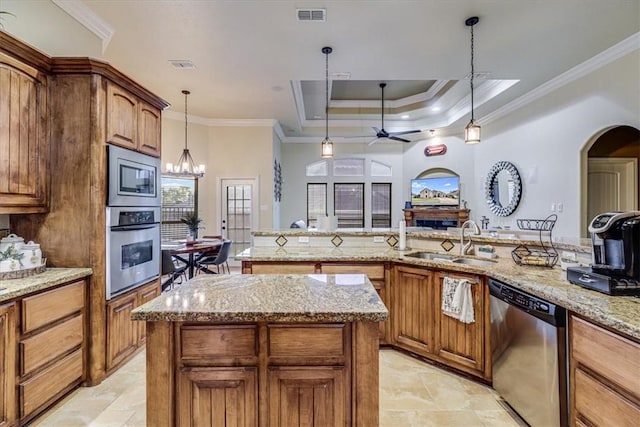 4530 Ballad Tree Dr, Corpus Christi, TX 78410 - kitchen featuring appliances with stainless steel finishes, a sink, crown molding, a kitchen island, and ceiling fan