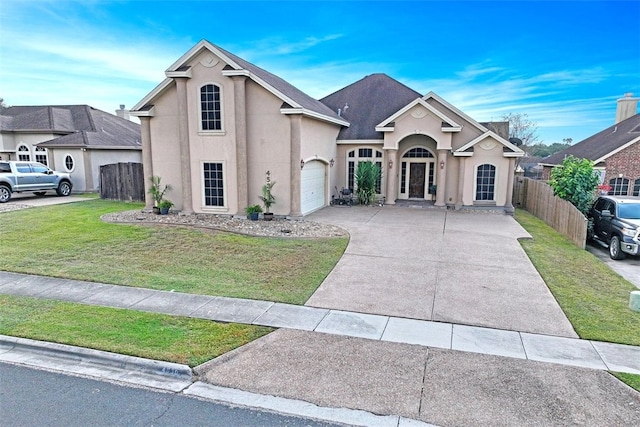 front facade with a garage and a front lawn