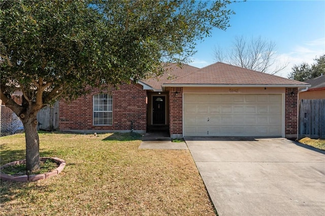 ranch-style home featuring a garage and a front yard