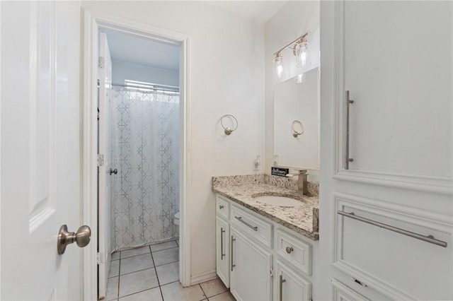 bathroom featuring vanity, tile patterned floors, and a shower with curtain