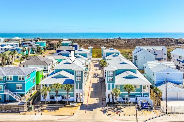 bird's eye view featuring a residential view and a water view