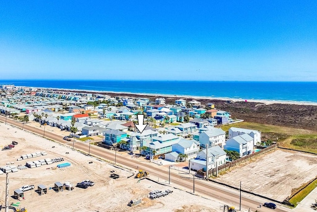 aerial view featuring a water view and a view of the beach