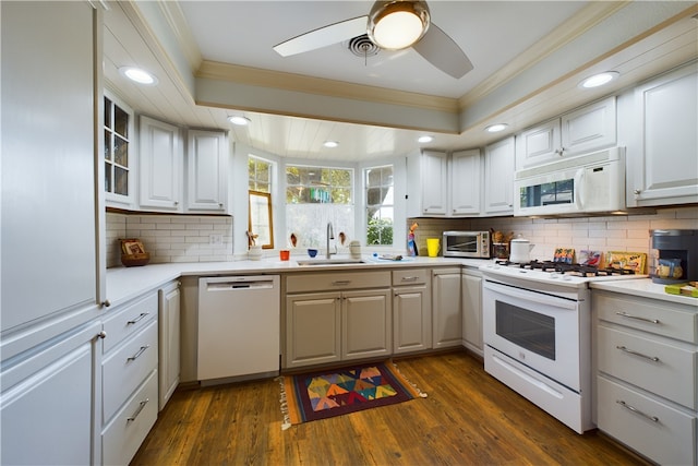 kitchen featuring white cabinetry, white appliances, crown molding, and dark wood-type flooring