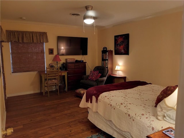 bedroom with dark hardwood / wood-style floors, ceiling fan, and ornamental molding