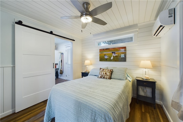 bedroom featuring wood ceiling, a wall mounted AC, dark wood-type flooring, ceiling fan, and a barn door