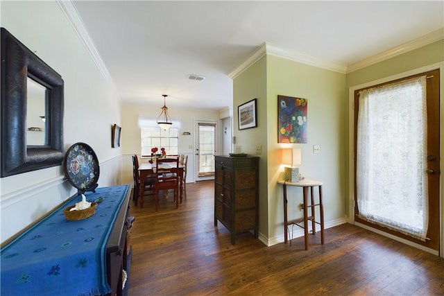 hall featuring crown molding and dark hardwood / wood-style floors