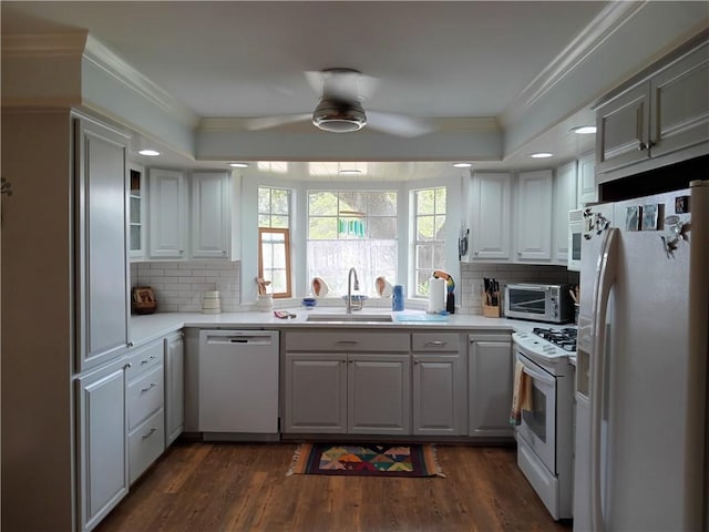 kitchen with white cabinetry, sink, ceiling fan, and white appliances