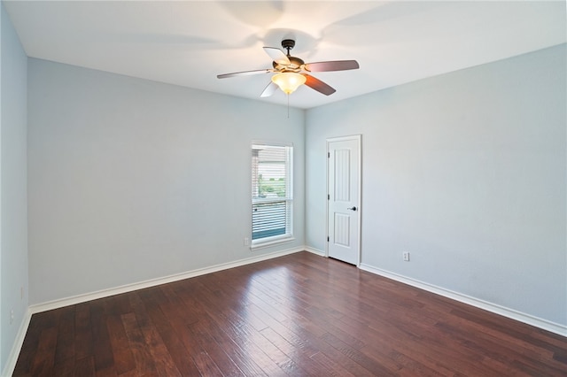 unfurnished room with ceiling fan and dark hardwood / wood-style floors