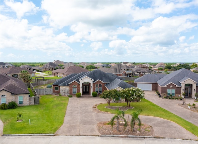 ranch-style home with a front yard and a garage