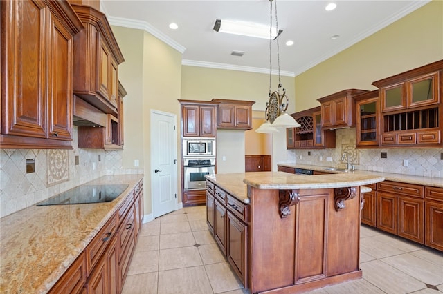 kitchen featuring appliances with stainless steel finishes, a center island, a kitchen bar, hanging light fixtures, and crown molding