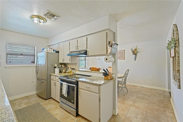 6205 Londonderry Dr, Corpus Christi, TX 78415 - kitchen featuring appliances with stainless steel finishes, under cabinet range hood, and a textured ceiling