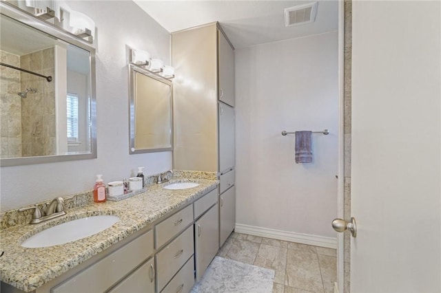 6205 Londonderry Dr, Corpus Christi, TX 78415 - full bathroom with double vanity and a tile shower