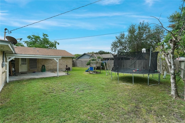 6205 Londonderry Dr, Corpus Christi, TX 78415 - fenced backyard with a trampoline and a patio