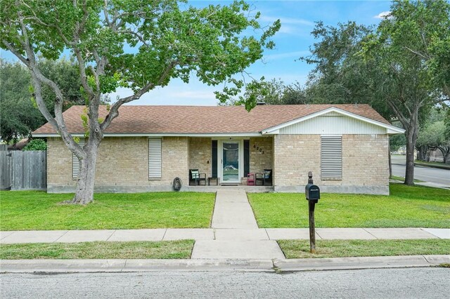 6205 Londonderry Dr, Corpus Christi, TX 78415 - ranch-style home featuring brick siding and roof with shingles