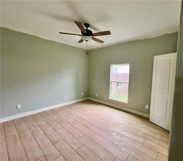 unfurnished room with ceiling fan and light wood-type flooring