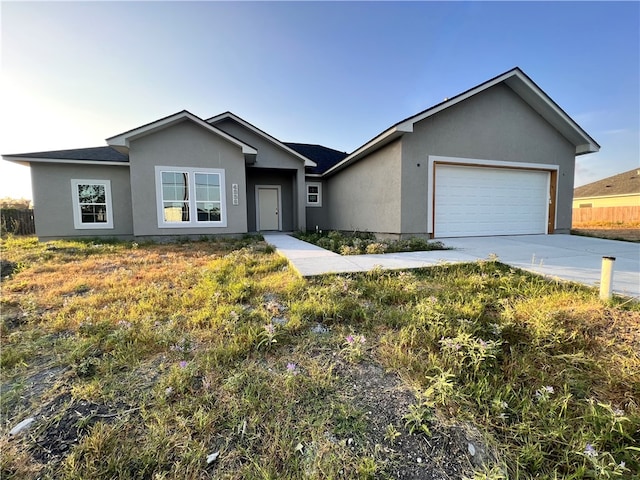 single story home with a garage