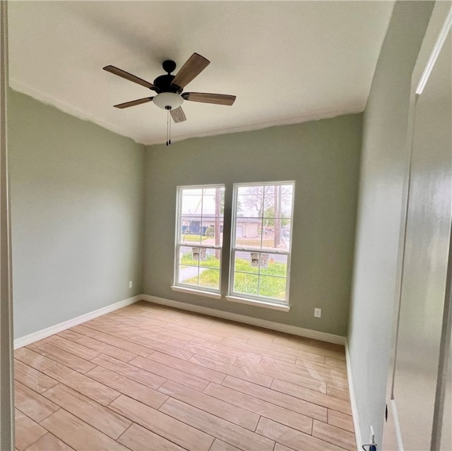 unfurnished room featuring ceiling fan and light wood-type flooring