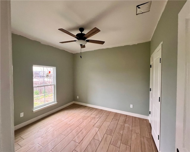 spare room with ceiling fan and light hardwood / wood-style flooring