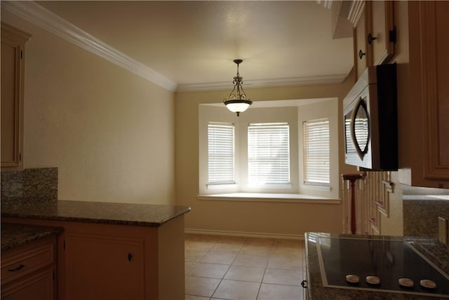 kitchen with black electric cooktop, stainless steel microwave, ornamental molding, pendant lighting, and a peninsula