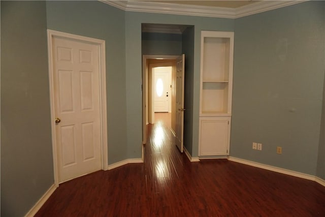 corridor with baseboards, dark wood-style floors, and crown molding