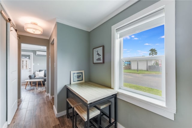 corridor featuring wood-type flooring, a wall mounted air conditioner, and crown molding