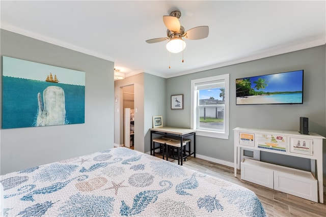 bedroom with crown molding, ceiling fan, and light hardwood / wood-style flooring