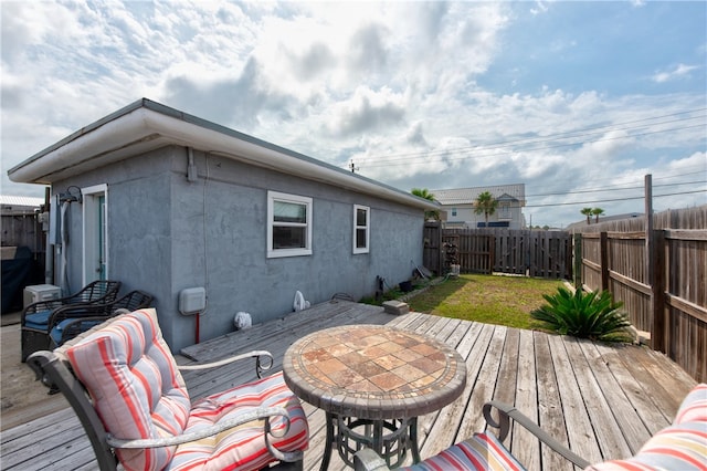 deck featuring a yard and area for grilling