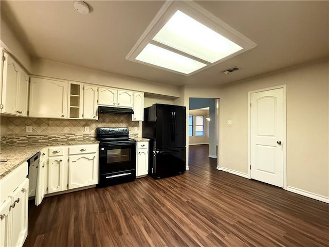 kitchen with dark wood-type flooring, white cabinets, backsplash, and black appliances