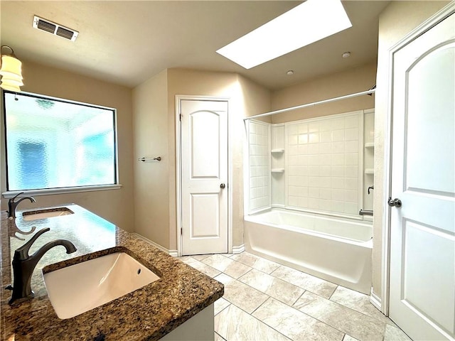 3325 Hampton St, Corpus Christi, TX 78414 - bathroom with a skylight, tub / shower combination, and double vanity