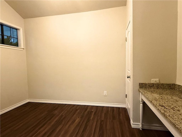 laundry area with dark hardwood / wood-style flooring