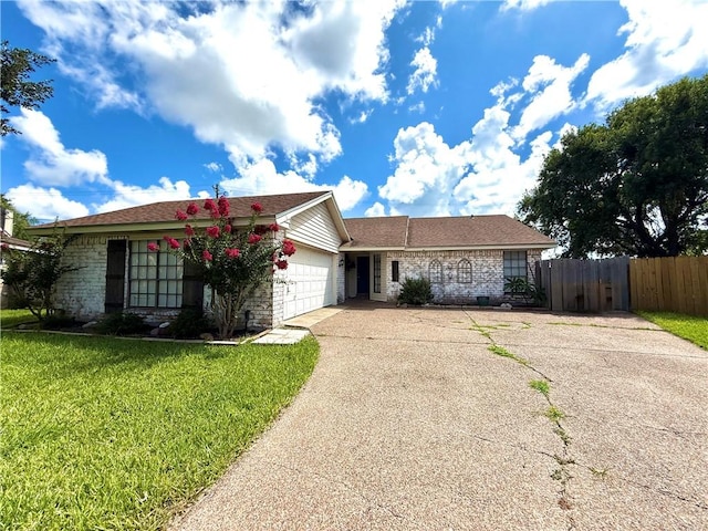3325 Hampton St, Corpus Christi, TX 78414 - ranch-style house with driveway, a garage, and brick siding