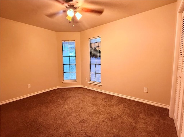 spare room with carpet and ceiling fan