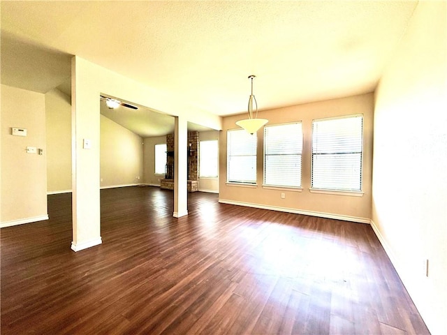 3325 Hampton St, Corpus Christi, TX 78414 - unfurnished dining area with dark wood finished floors, ornate columns, and lofted ceiling