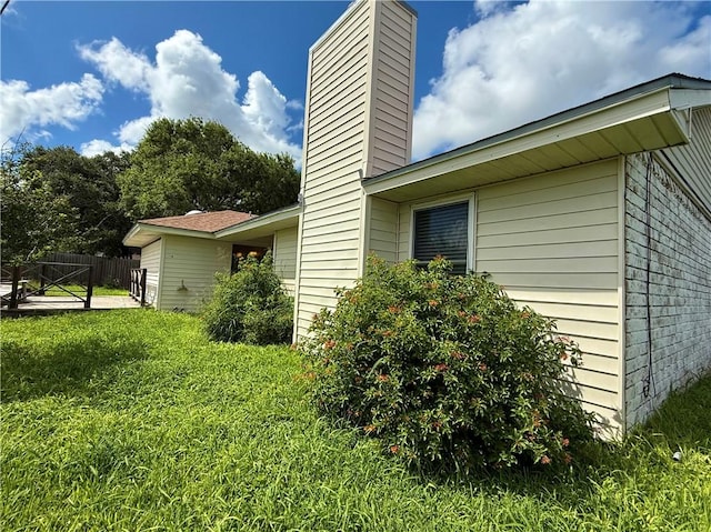 3325 Hampton St, Corpus Christi, TX 78414 - view of side of property with a chimney