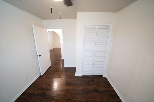 hallway featuring dark hardwood / wood-style flooring