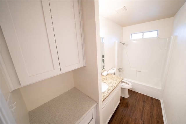 full bathroom with hardwood / wood-style flooring, vanity, toilet, and bathing tub / shower combination