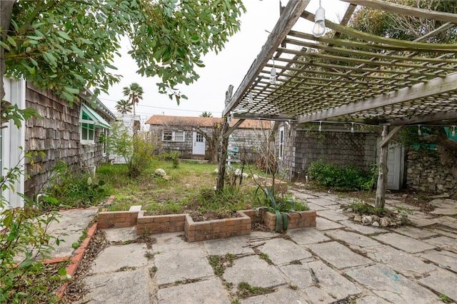 view of yard featuring a patio area and a pergola